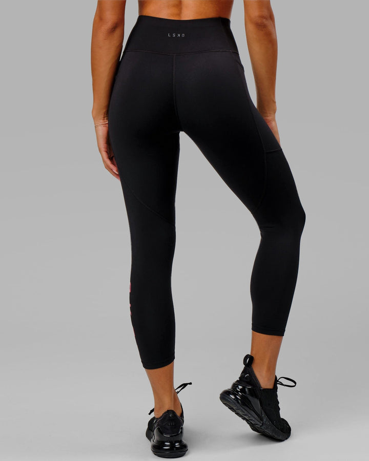 Woman wearing Rep 7/8 Length Tight - Black-Boysenberry