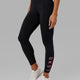 Woman wearing Rep 7/8 Length Tight - Black-Flamingo