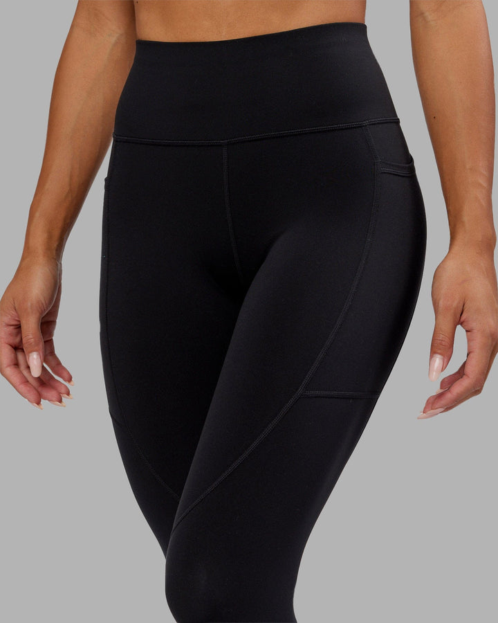 Woman wearing Rep 7/8 Length Tight - Black-Hyper Teal