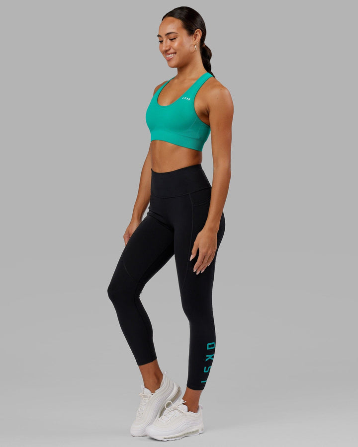 Woman wearing Rep 7/8 Length Tight - Black-Hyper Teal
