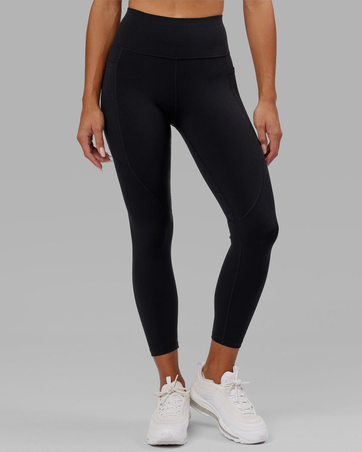 Woman wearing Rep 7/8 Length Tight - Black-Hyper Teal