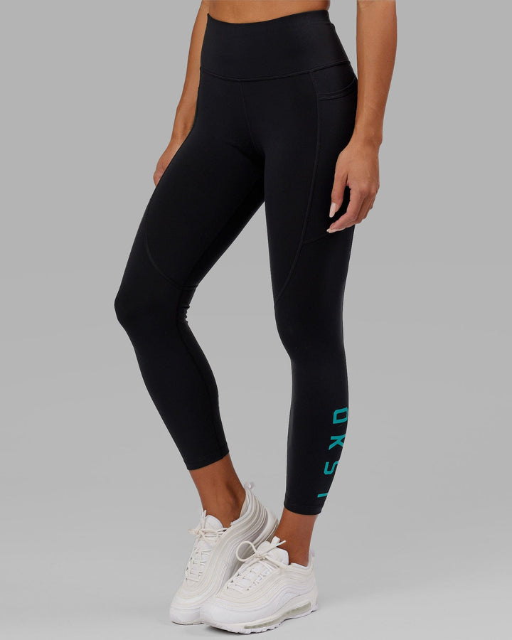 Woman wearing Rep 7/8 Length Tight - Black-Hyper Teal