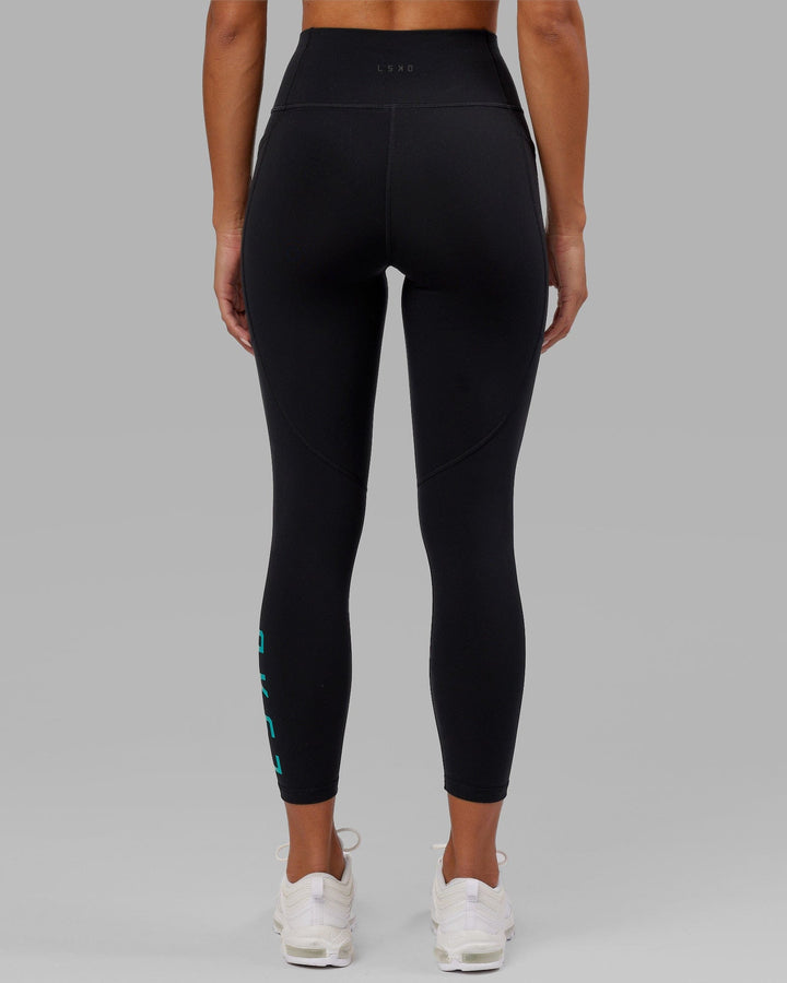 Woman wearing Rep 7/8 Length Tight - Black-Hyper Teal