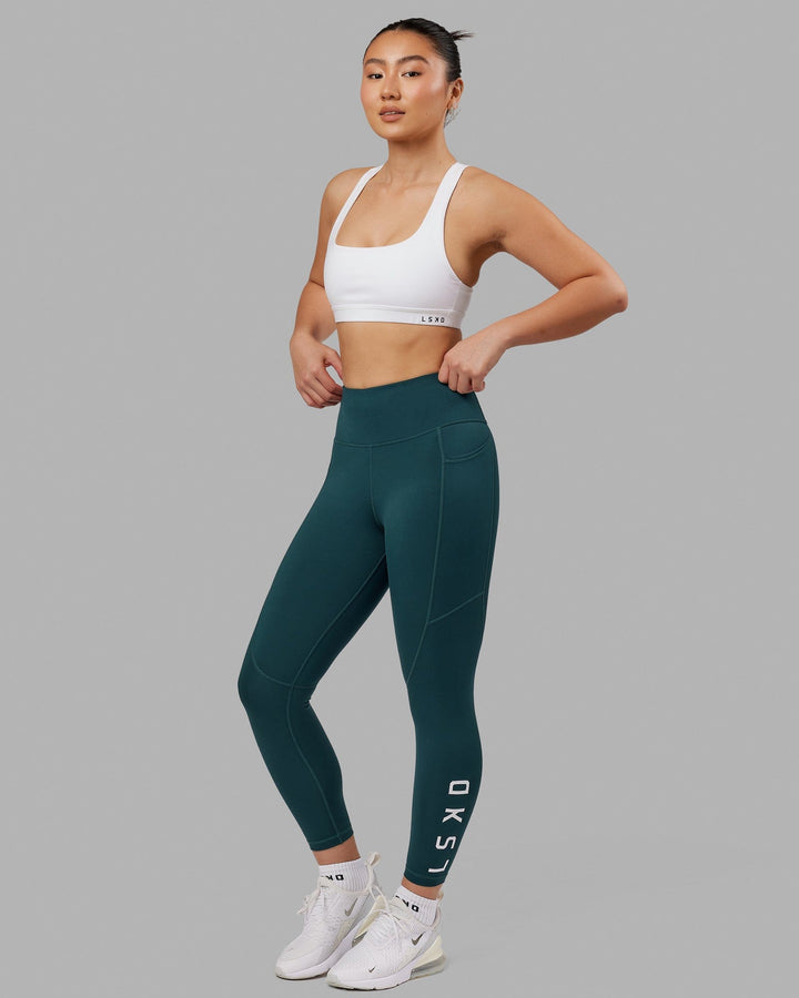 Woman wearing Rep 7/8 Length Tight - Deep Teal