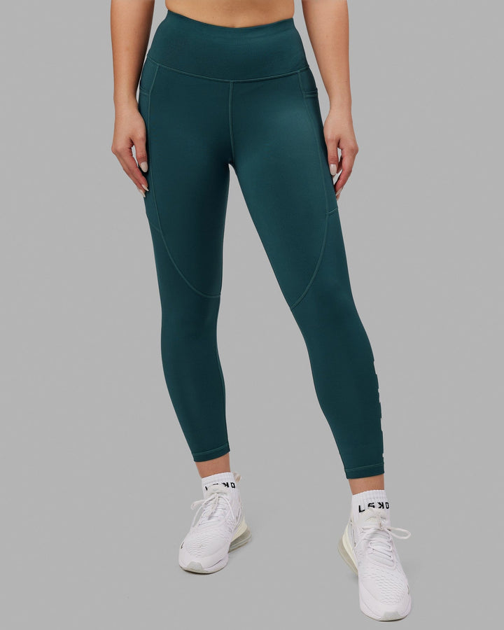 Woman wearing Rep 7/8 Length Tight - Deep Teal