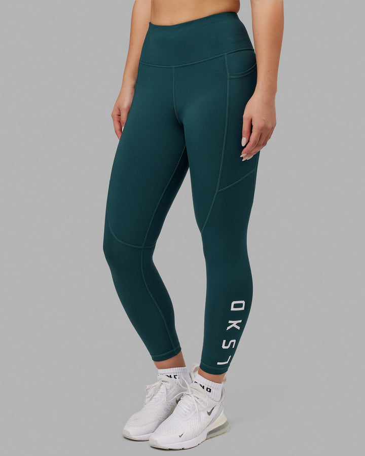 Woman wearing Rep 7/8 Length Tight - Deep Teal
