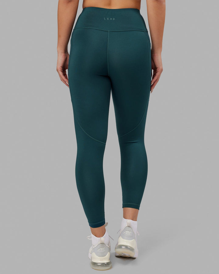 Woman wearing Rep 7/8 Length Tight - Deep Teal