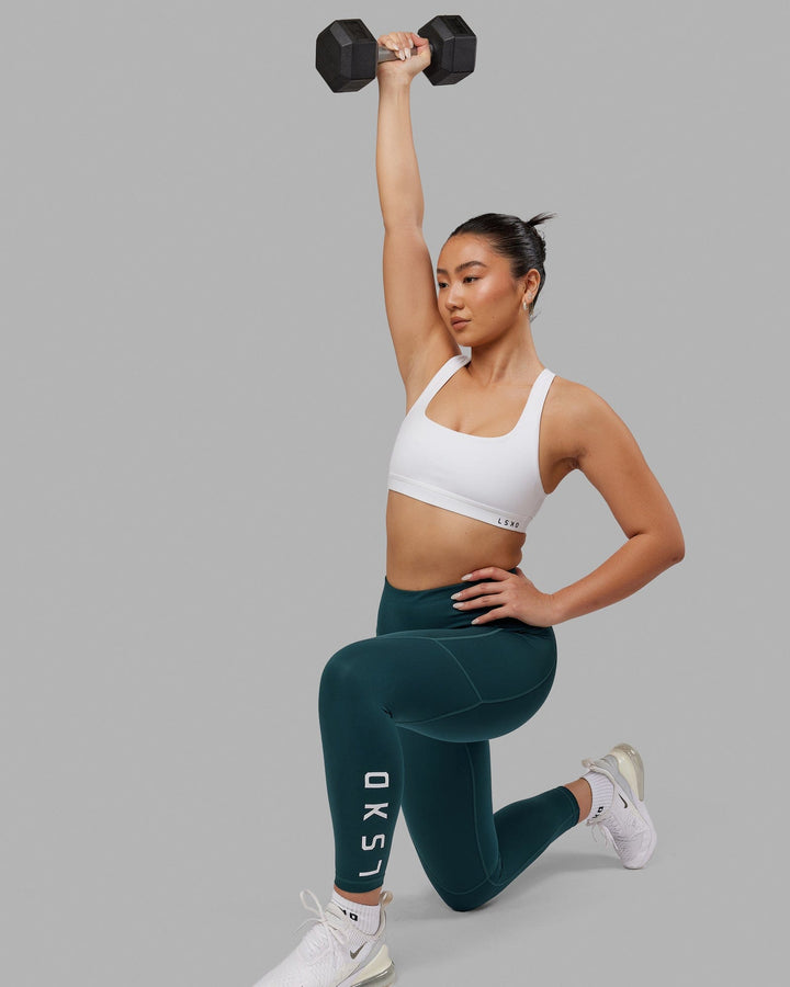 Woman wearing Rep 7/8 Length Tight - Deep Teal