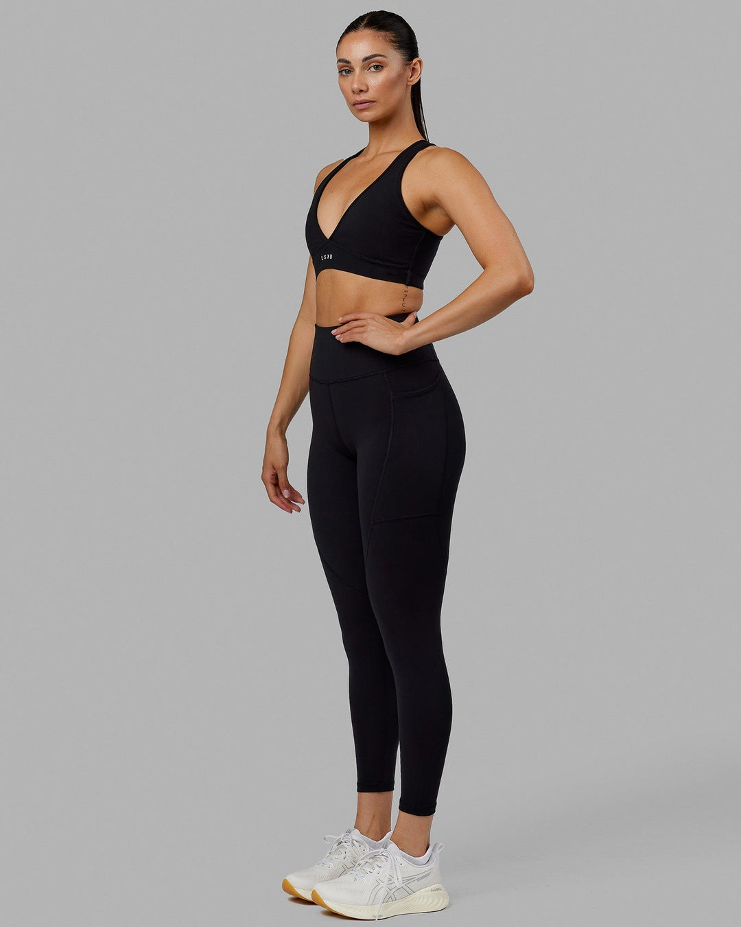 Woman wearing Rep Ultra High-Rise 7/8 Legging Pockets No Logo - Black | Model:Blaize | Size:S