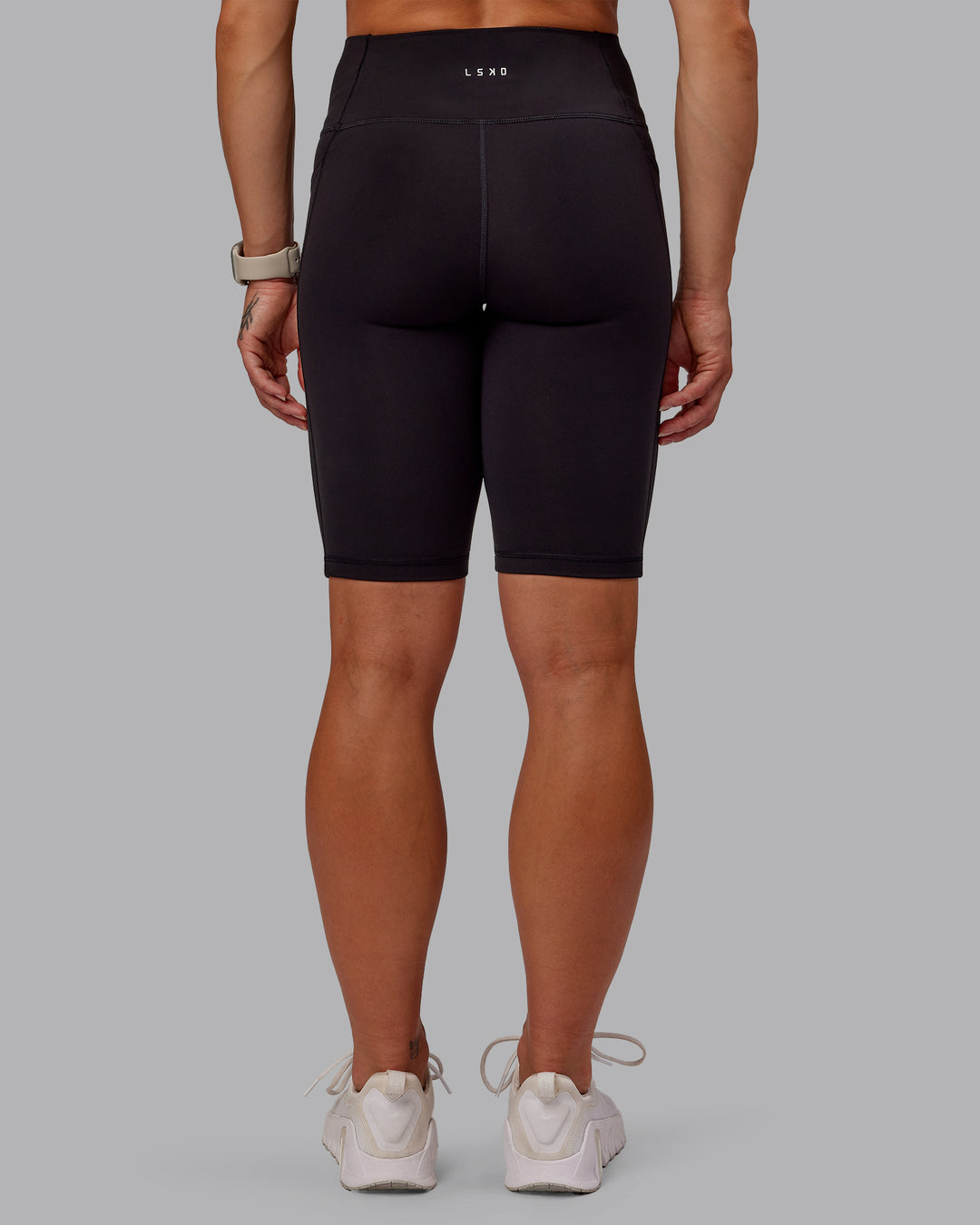 Woman wearing Rep Ultra High-Rise 9" Short Pockets - Black-Surreal Green | Model:Amber | Size:S