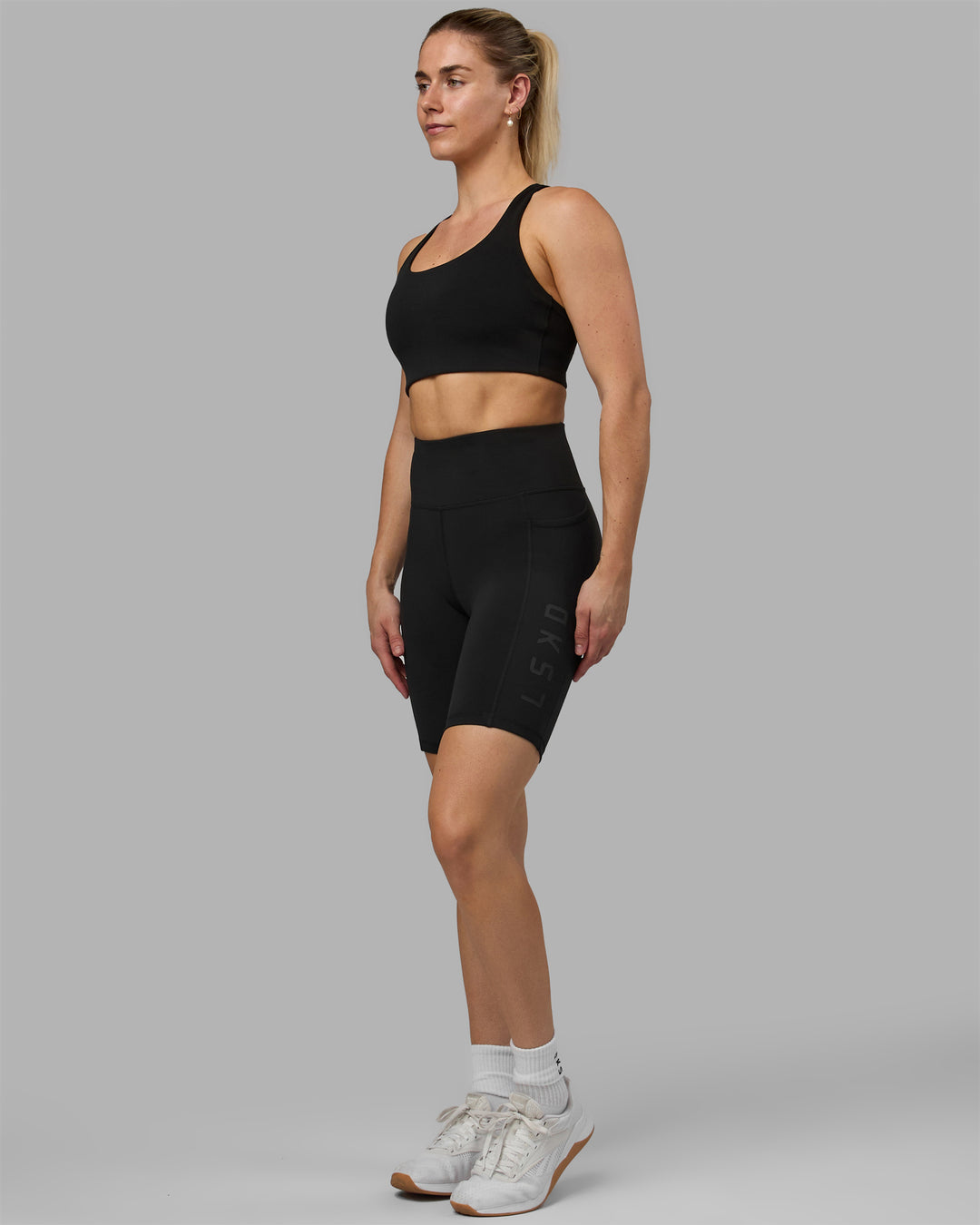 Woman wearing Rep Ultra High-Rise 9&quot; Short Pockets - Black-Black | Model:Hannah | Size:S