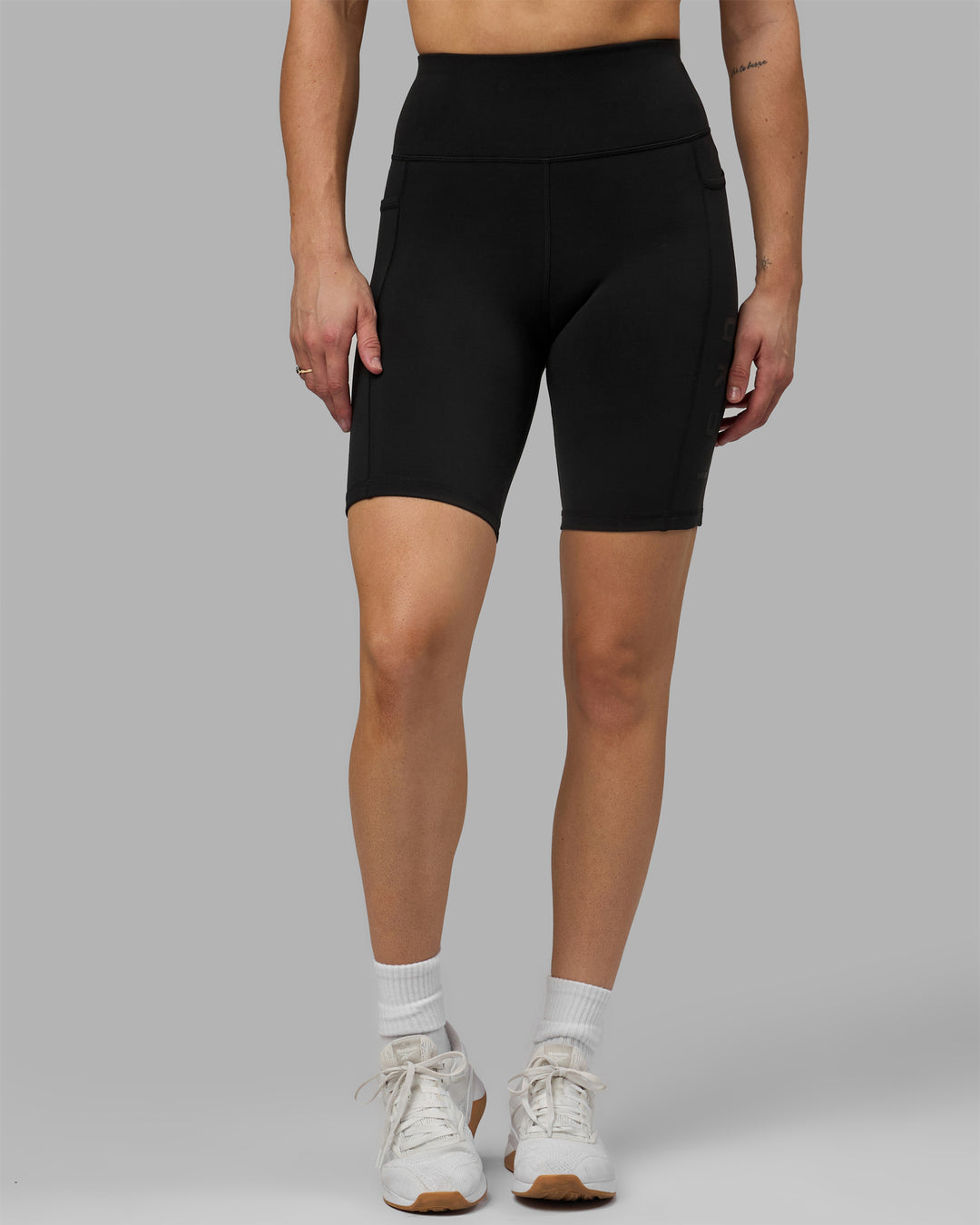 Woman wearing Rep Ultra High-Rise 9&quot; Short Pockets - Black-Black | Model:Hannah | Size:S