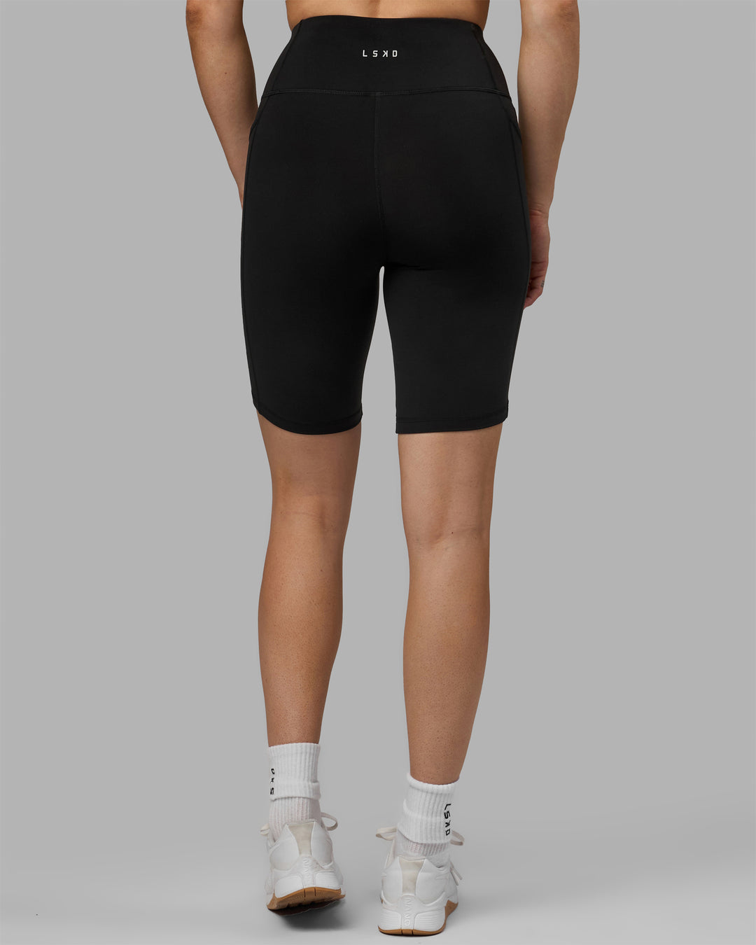 Woman wearing Rep Ultra High-Rise 9&quot; Short Pockets - Black-Black | Model:Hannah | Size:S