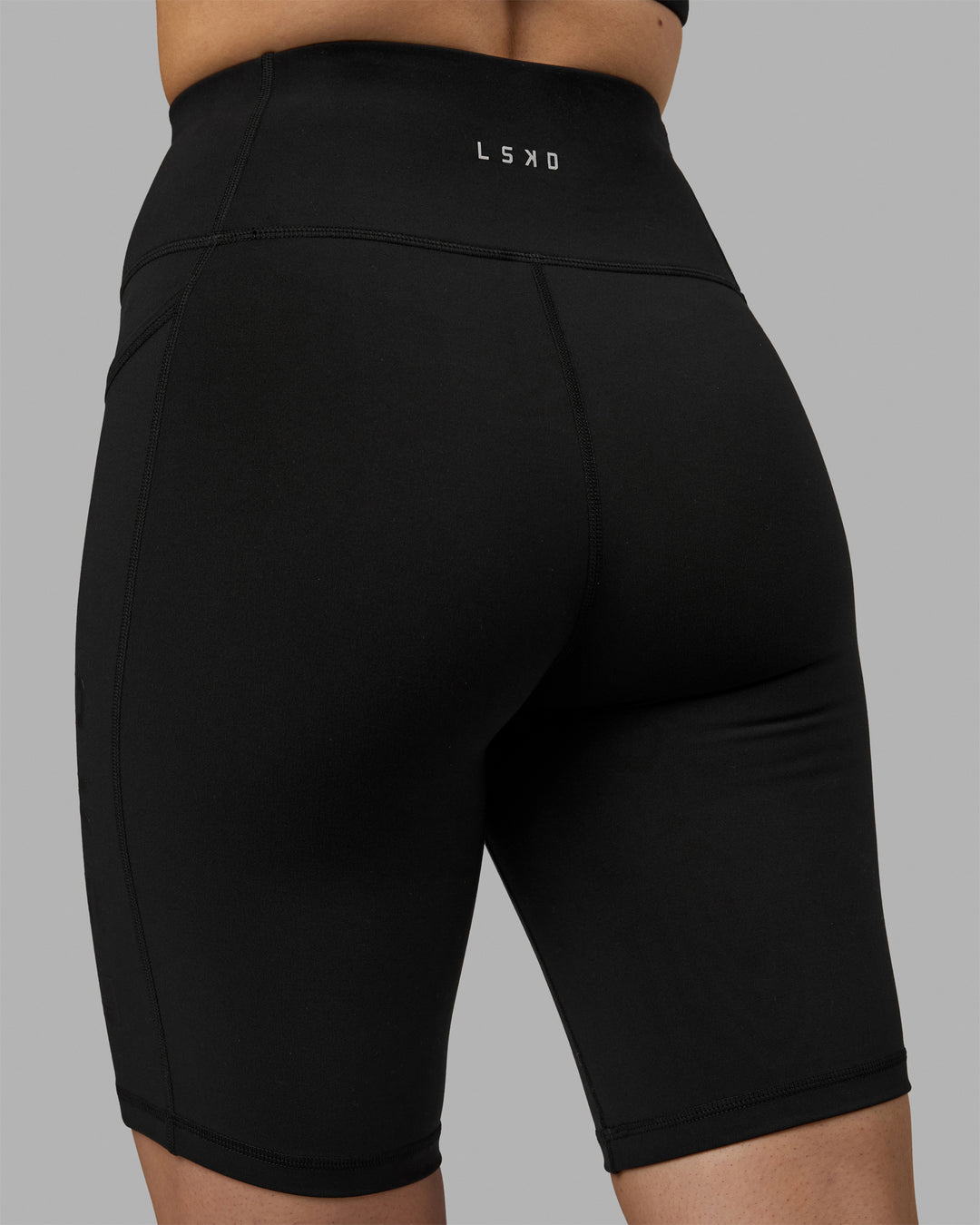 Woman wearing Rep Ultra High-Rise 9&quot; Short Pockets - Black-Black | Model:Hannah | Size:S