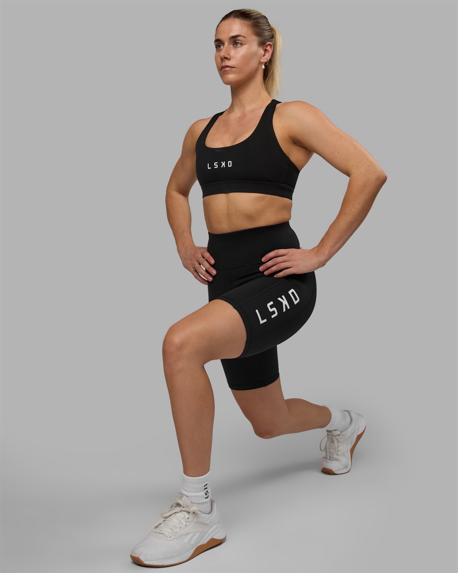 Woman wearing Rep Ultra High-Rise 9" Short Pockets - Black-White | Model:Hannah | Size:S