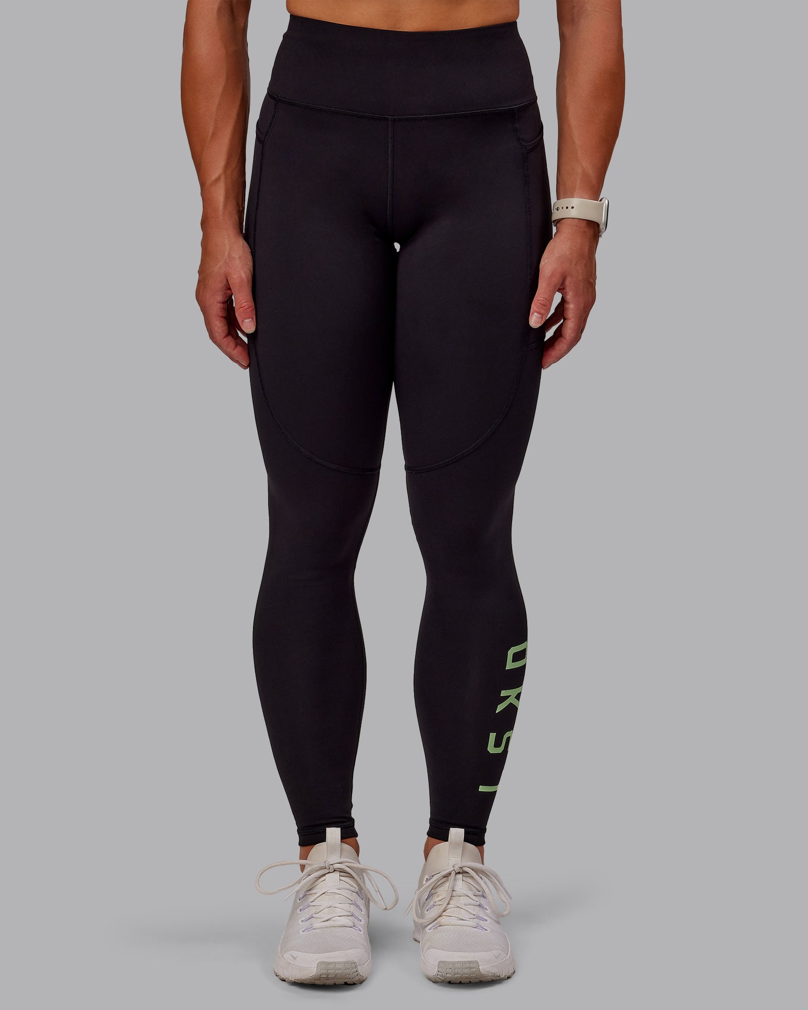 Woman wearing Rep Ultra High-Rise Full Length Legging Pockets - Black-Surreal Green | Model:Amber | Size:S