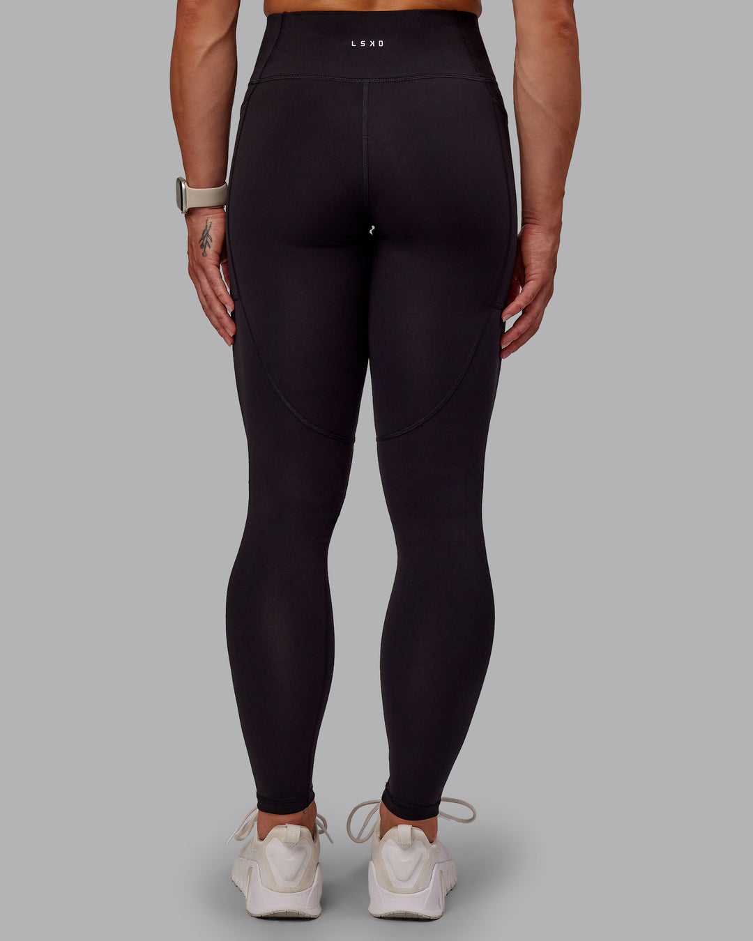 Woman wearing Rep Ultra High-Rise Full Length Legging Pockets - Black-Surreal Green | Model:Amber | Size:S