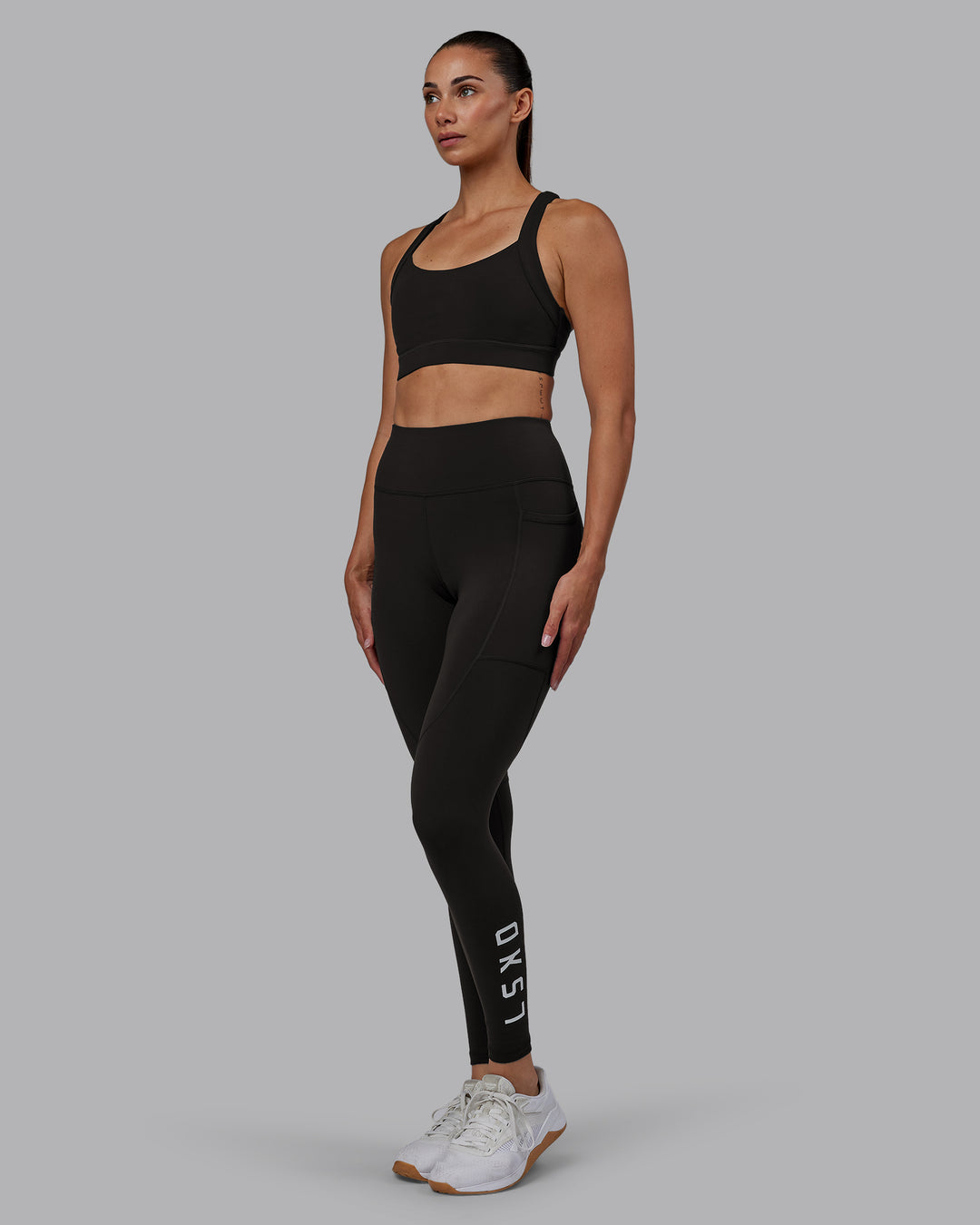 Woman wearing Rep Ultra High-Rise Full Length Legging Pockets - Pirate Black-White | Model:Blaize | Size:S