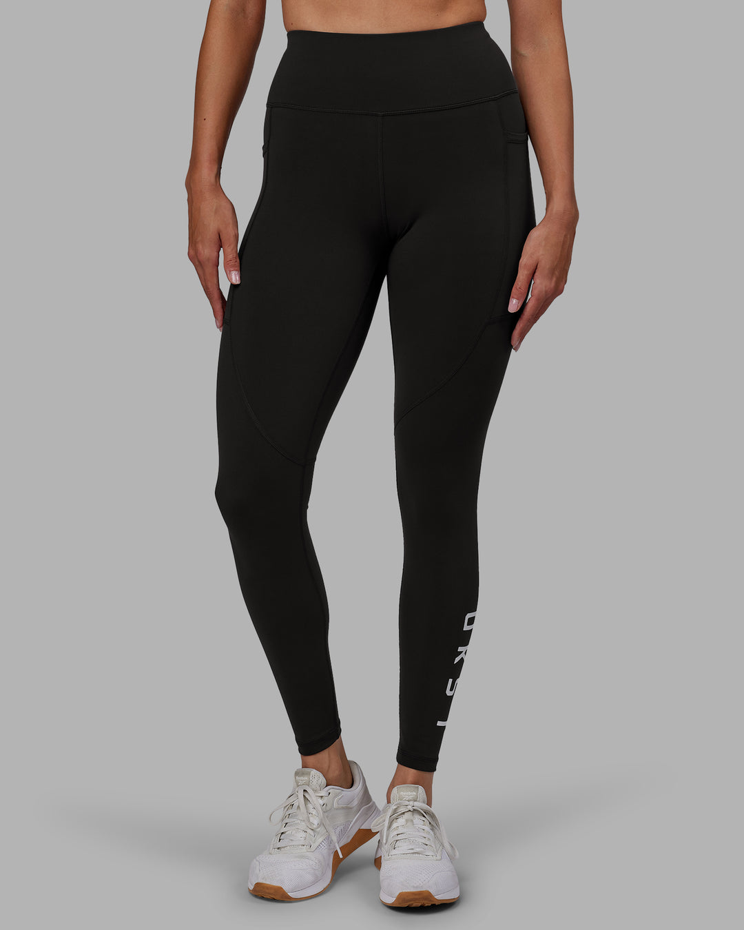Woman wearing Rep Ultra High-Rise Full Length Legging Pockets - Pirate Black-White | Model:Blaize | Size:S