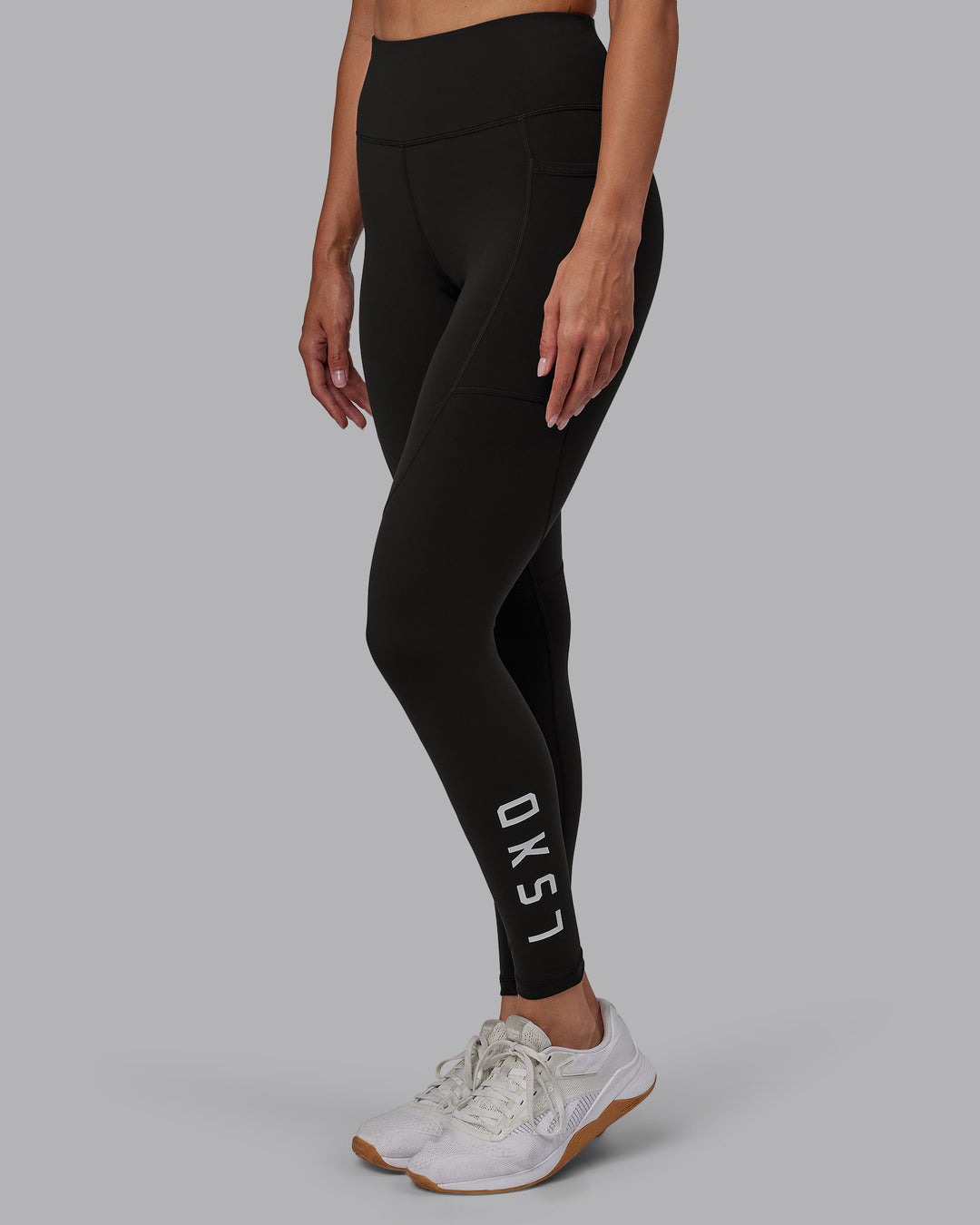 Woman wearing Rep Ultra High-Rise Full Length Legging Pockets - Pirate Black-White | Model:Blaize | Size:S