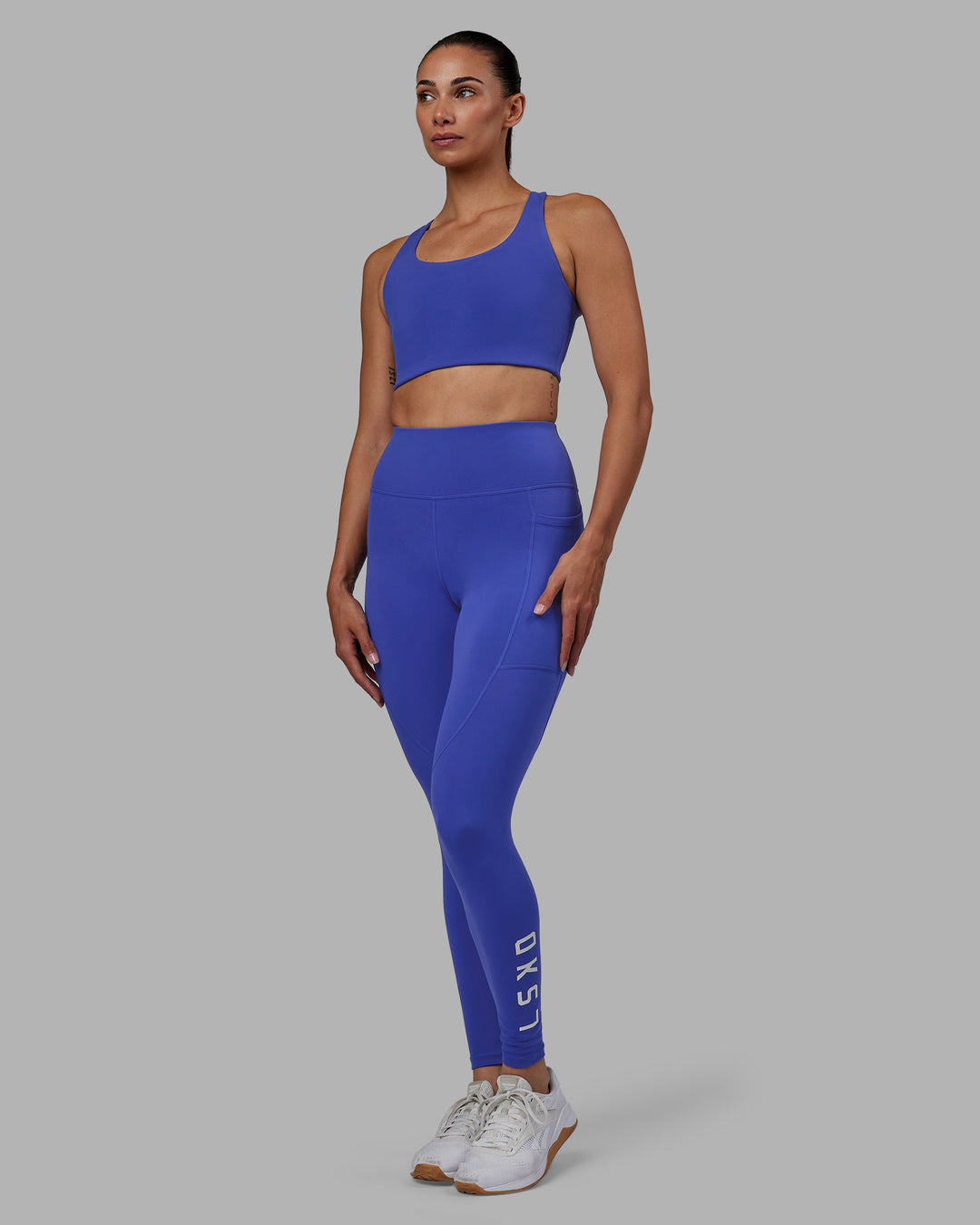 Woman wearing Rep Ultra High-Rise Full Length Legging Pockets - Power Cobalt-White | Model:Blaize | Size:S