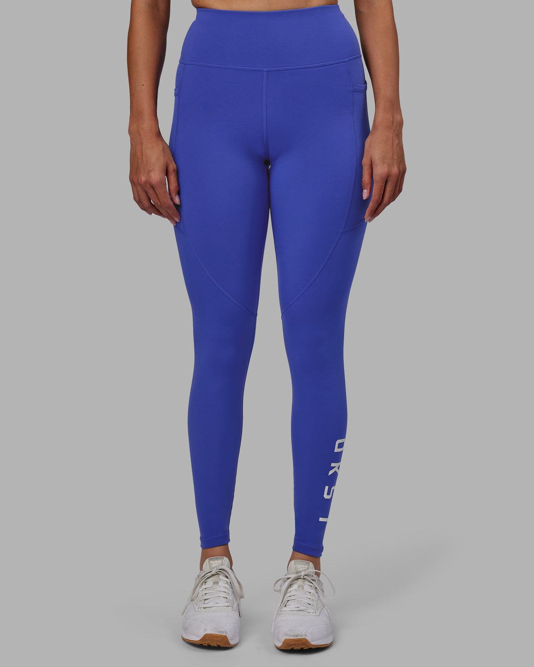 Woman wearing Rep Ultra High-Rise Full Length Legging Pockets - Power Cobalt-White | Model:Blaize | Size:S