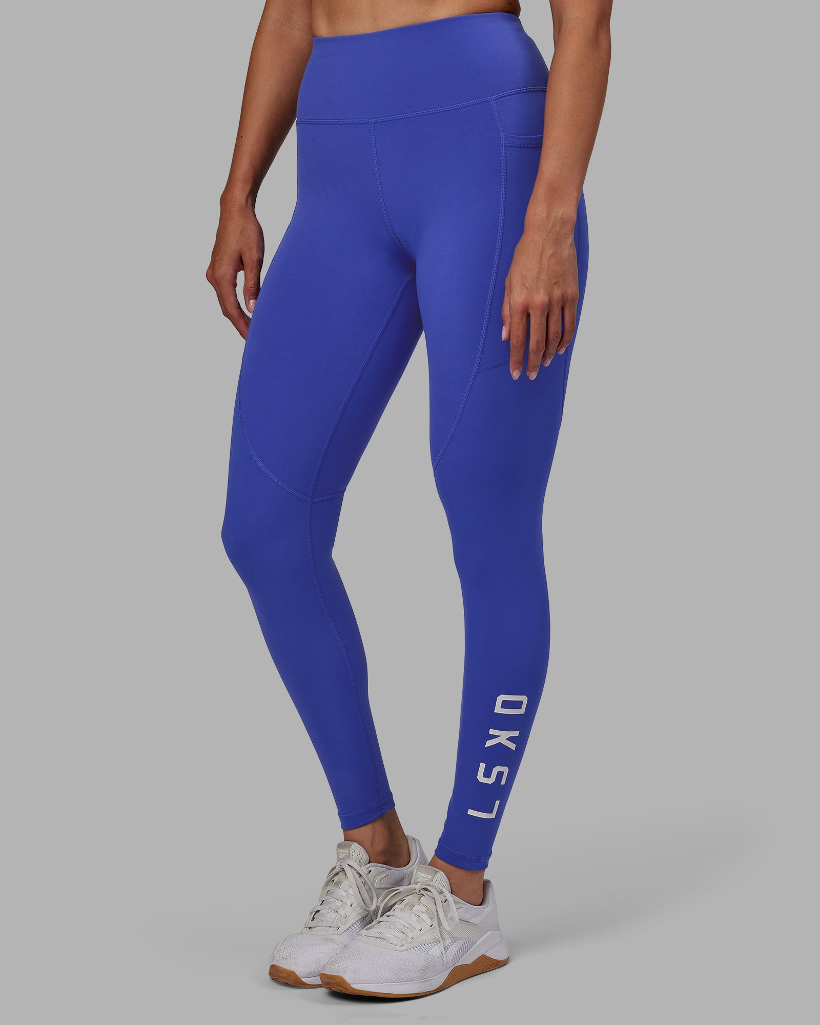 Woman wearing Rep Ultra High-Rise Full Length Legging Pockets - Power Cobalt-White | Model:Blaize | Size:S