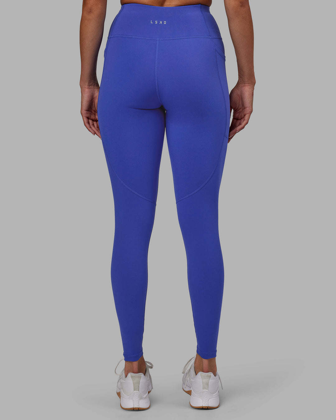 Woman wearing Rep Ultra High-Rise Full Length Legging Pockets - Power Cobalt-White | Model:Blaize | Size:S