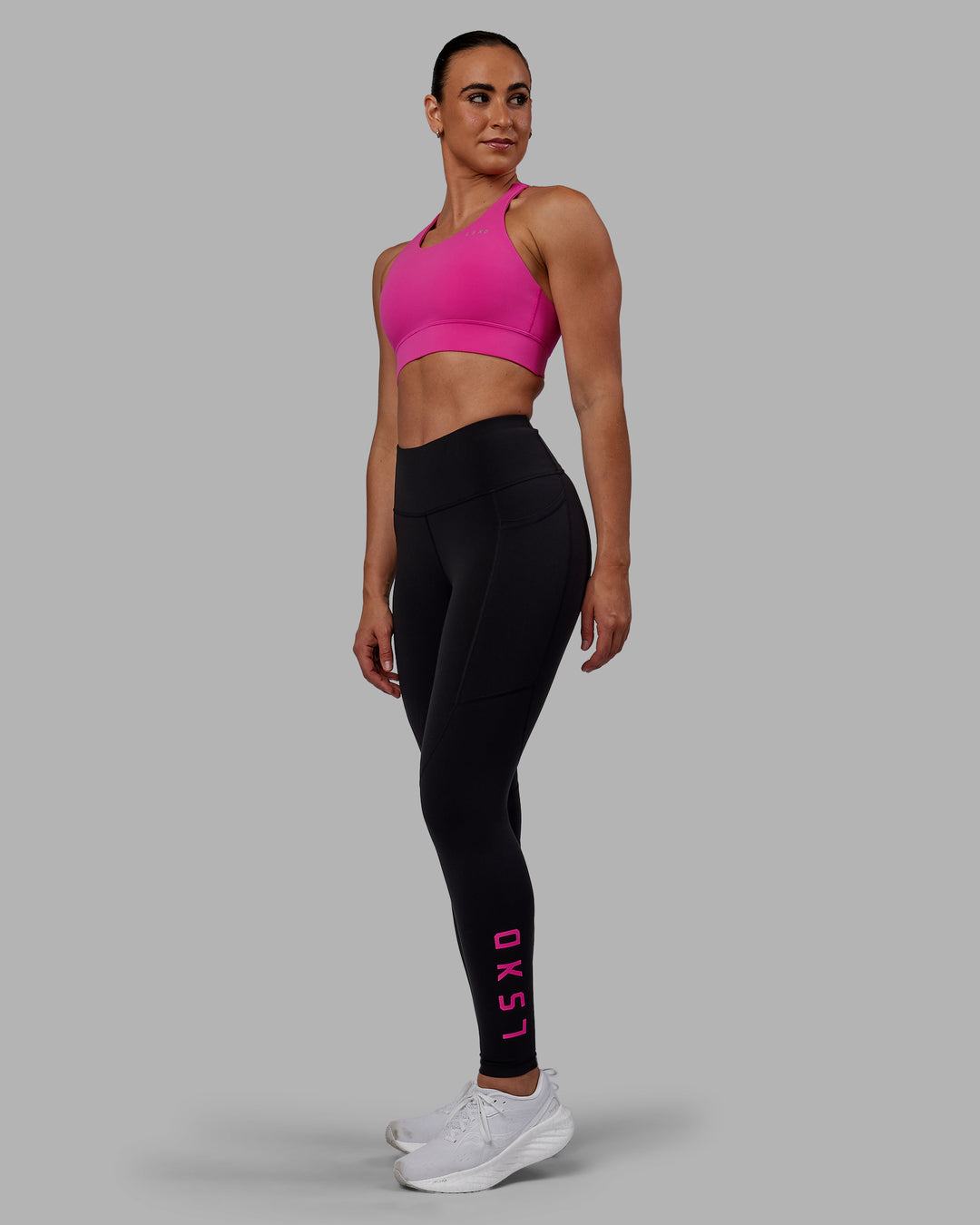 Woman wearing Rep Ultra High-Rise Full Length Legging Pockets - Black-Fuchsia Pink | Model:Sophie | Size:S