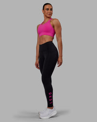 Woman wearing Rep Ultra High-Rise Full Length Legging Pockets - Black-Fuchsia Pink | Model:Sophie | Size:S