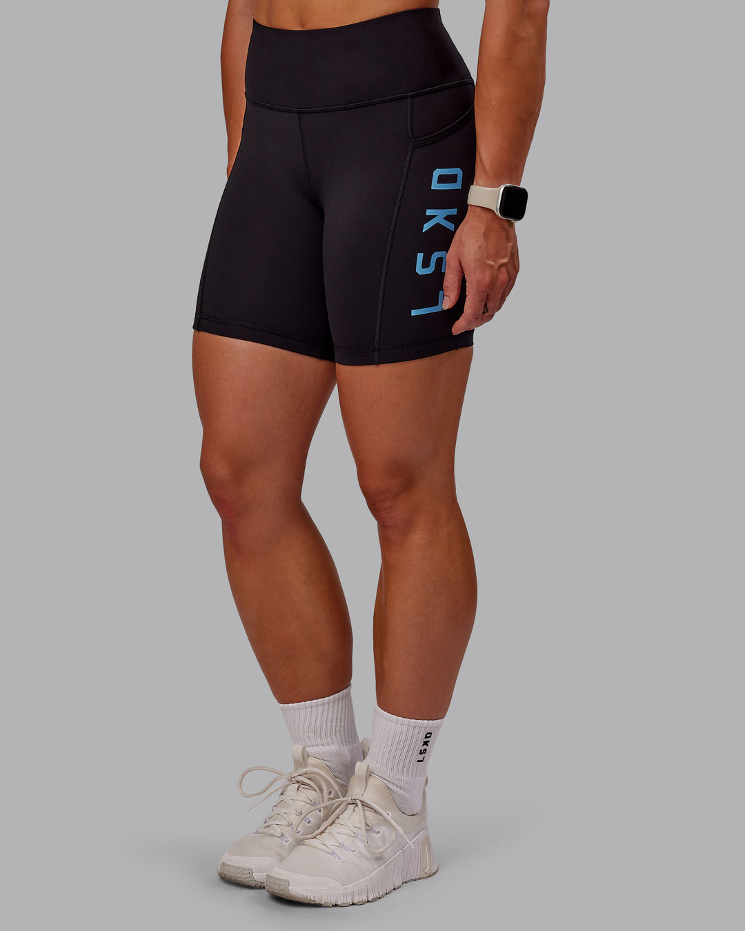 Woman wearing Rep Ultra High-Rise 6&quot; Short Pockets - Black-Azure Blue | Model:Amber | Size:S