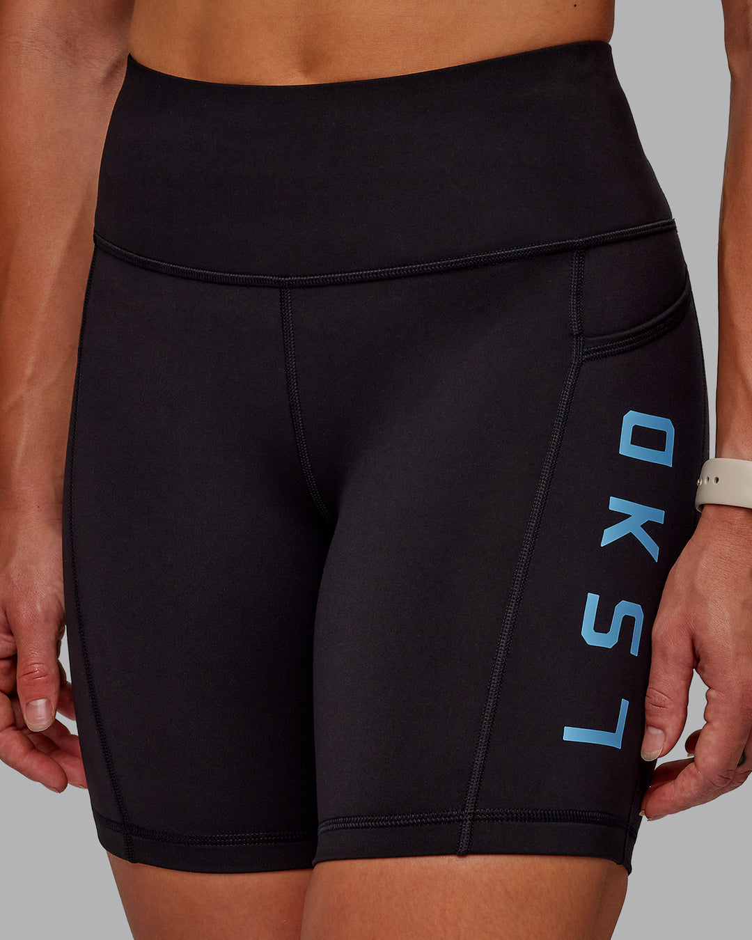 Woman wearing Rep Ultra High-Rise 6&quot; Short Pockets - Black-Azure Blue | Model:Amber | Size:S