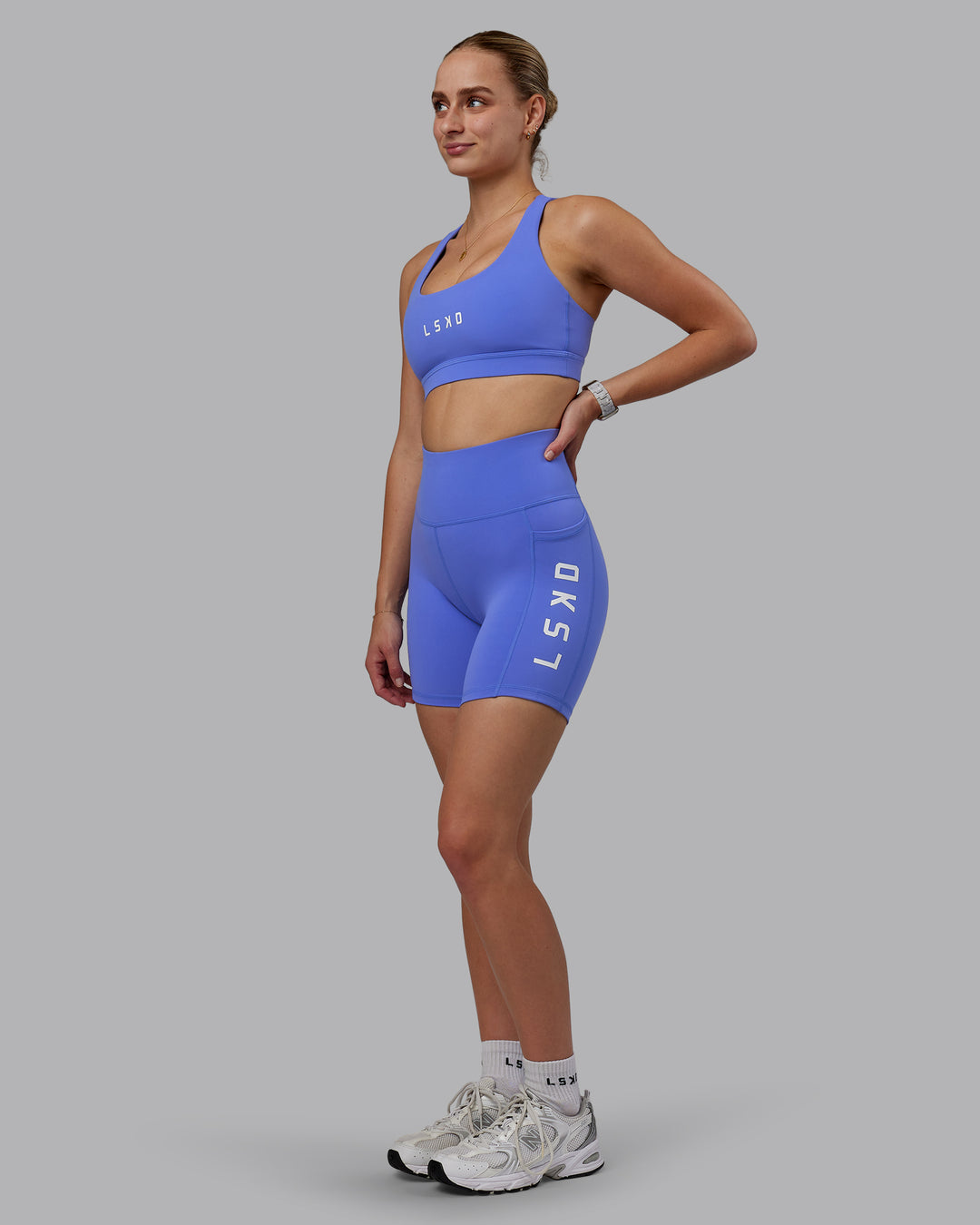 Woman wearing Rep Ultra High-Rise 6&quot; Short Pockets - Baja Blue-White | Model:Lillie | Size:S