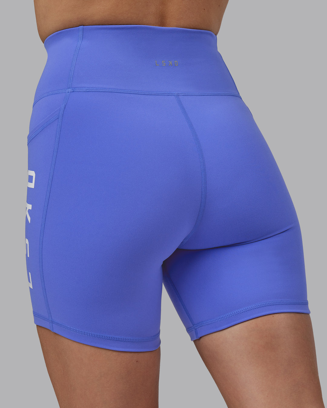 Woman wearing Rep Ultra High-Rise 6&quot; Short Pockets - Baja Blue-White | Model:Lillie | Size:S