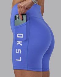 Woman wearing Rep Ultra High-Rise 6" Short Pockets - Baja Blue-White | Model:Lillie | Size:S