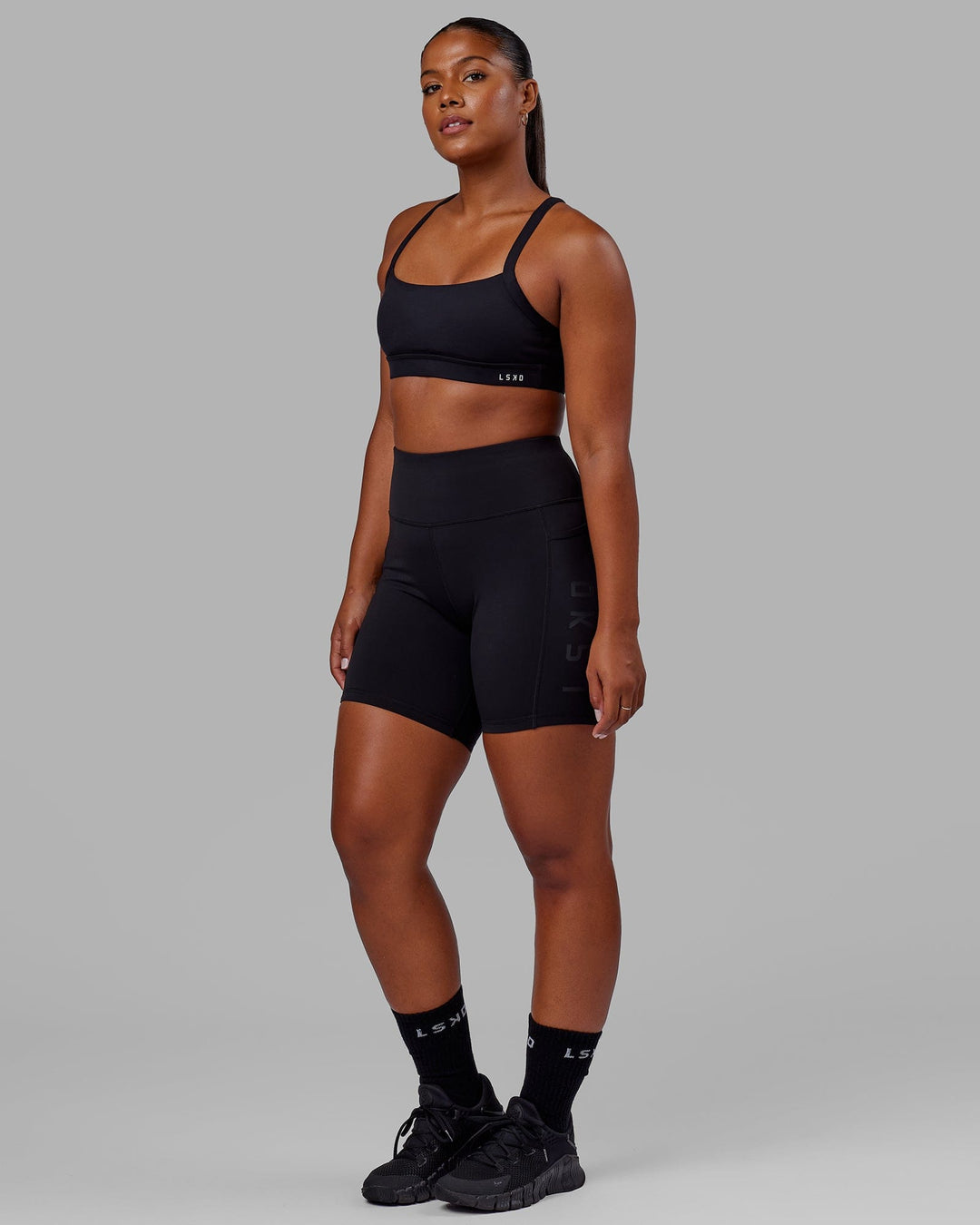 Woman wearing Rep Ultra High-Rise 6" Short Pockets - Black-Black | Model:Sierra | Size:L