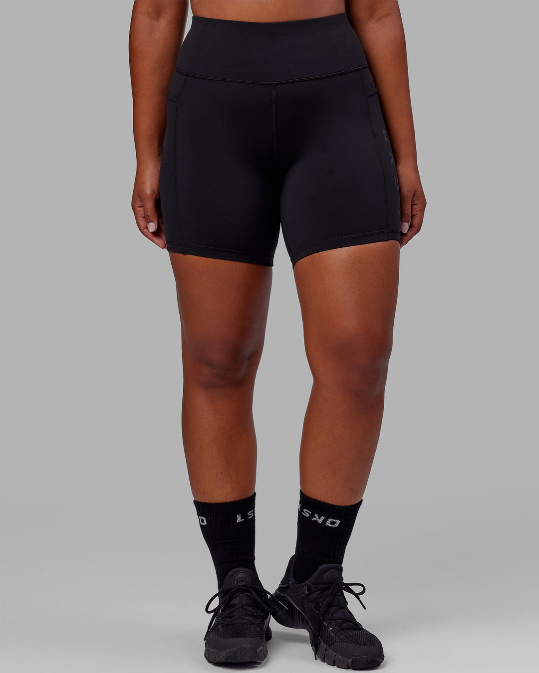 Woman wearing Rep Ultra High-Rise 6&quot; Short Pockets - Black-Black | Model:Sierra | Size:L