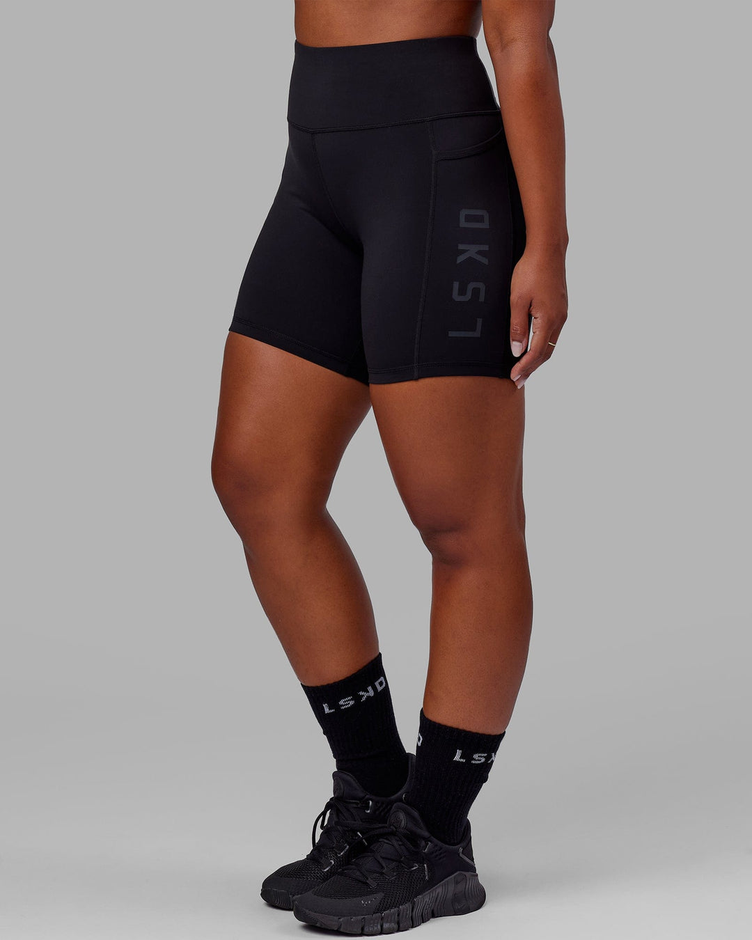 Woman wearing Rep Ultra High-Rise 6&quot; Short Pockets - Black-Black | Model:Sierra | Size:L