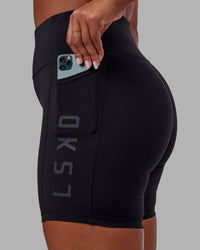 Woman wearing Rep Ultra High-Rise 6" Short Pockets - Black-Black | Model:Sierra | Size:L