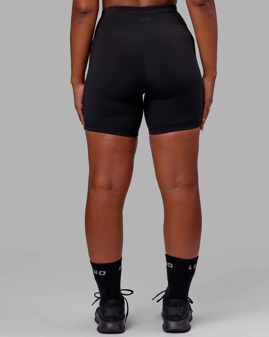 Woman wearing Rep Ultra High-Rise 6&quot; Short Pockets - Black-Black | Model:Sierra | Size:L