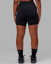 Woman wearing Rep Ultra High-Rise 6" Short Pockets - Black-Black | Model:Sierra | Size:L