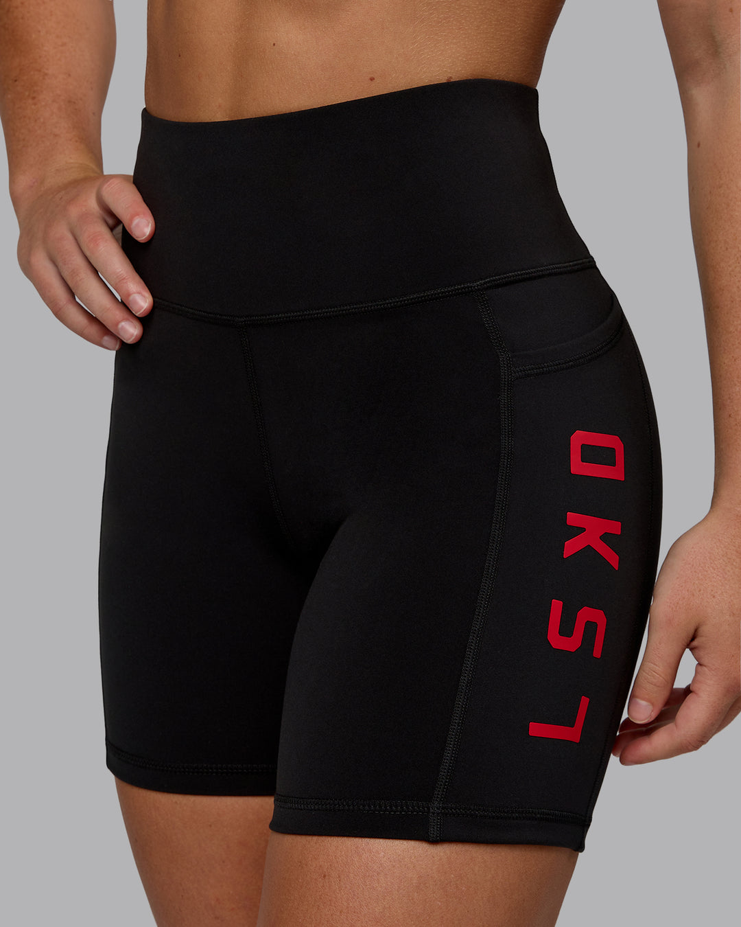 Woman wearing Rep Ultra High-Rise 6&quot; Short Pockets - Black-Crimson | Model:Monique | Size:S