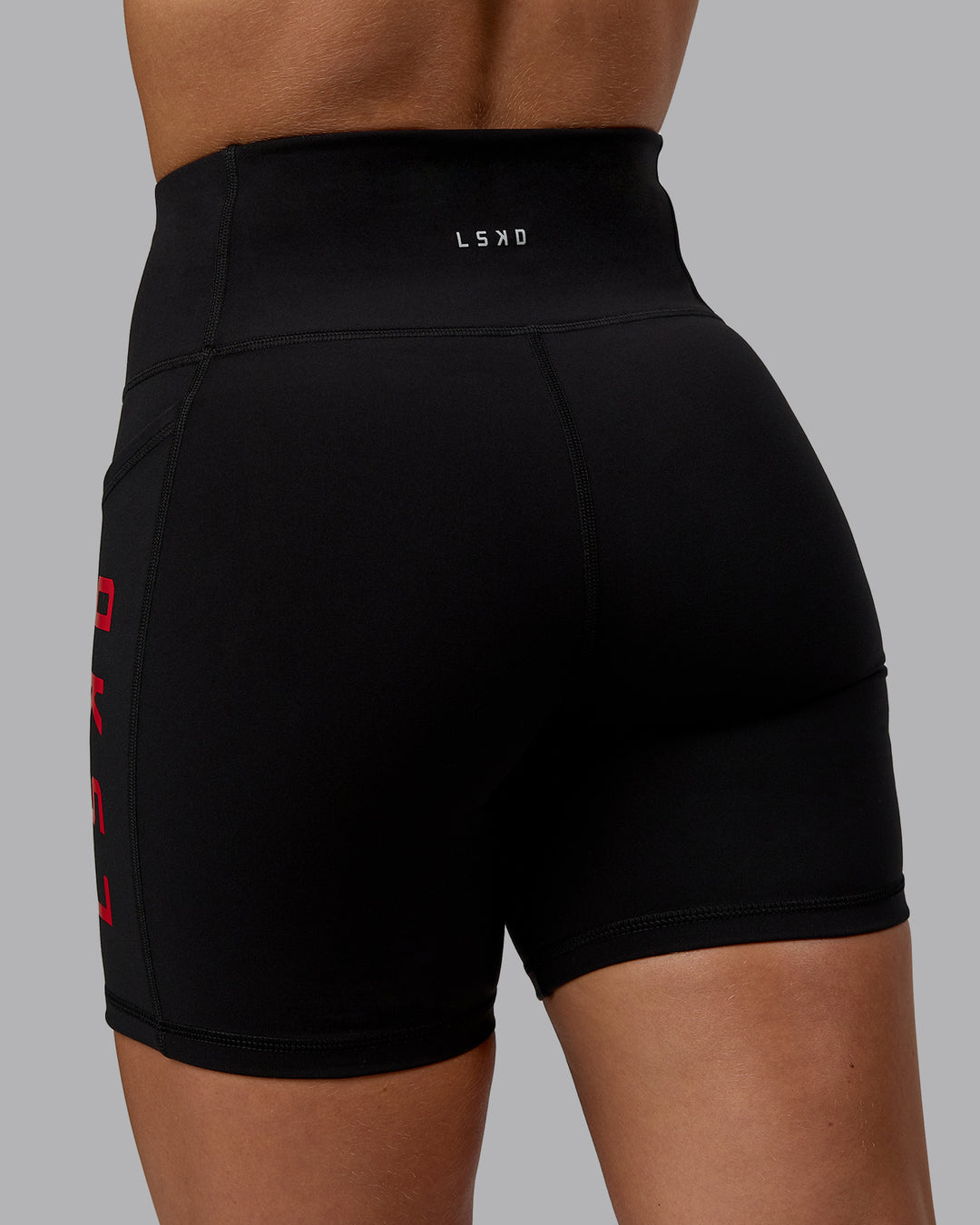 Woman wearing Rep Ultra High-Rise 6&quot; Short Pockets - Black-Crimson | Model:Monique | Size:S