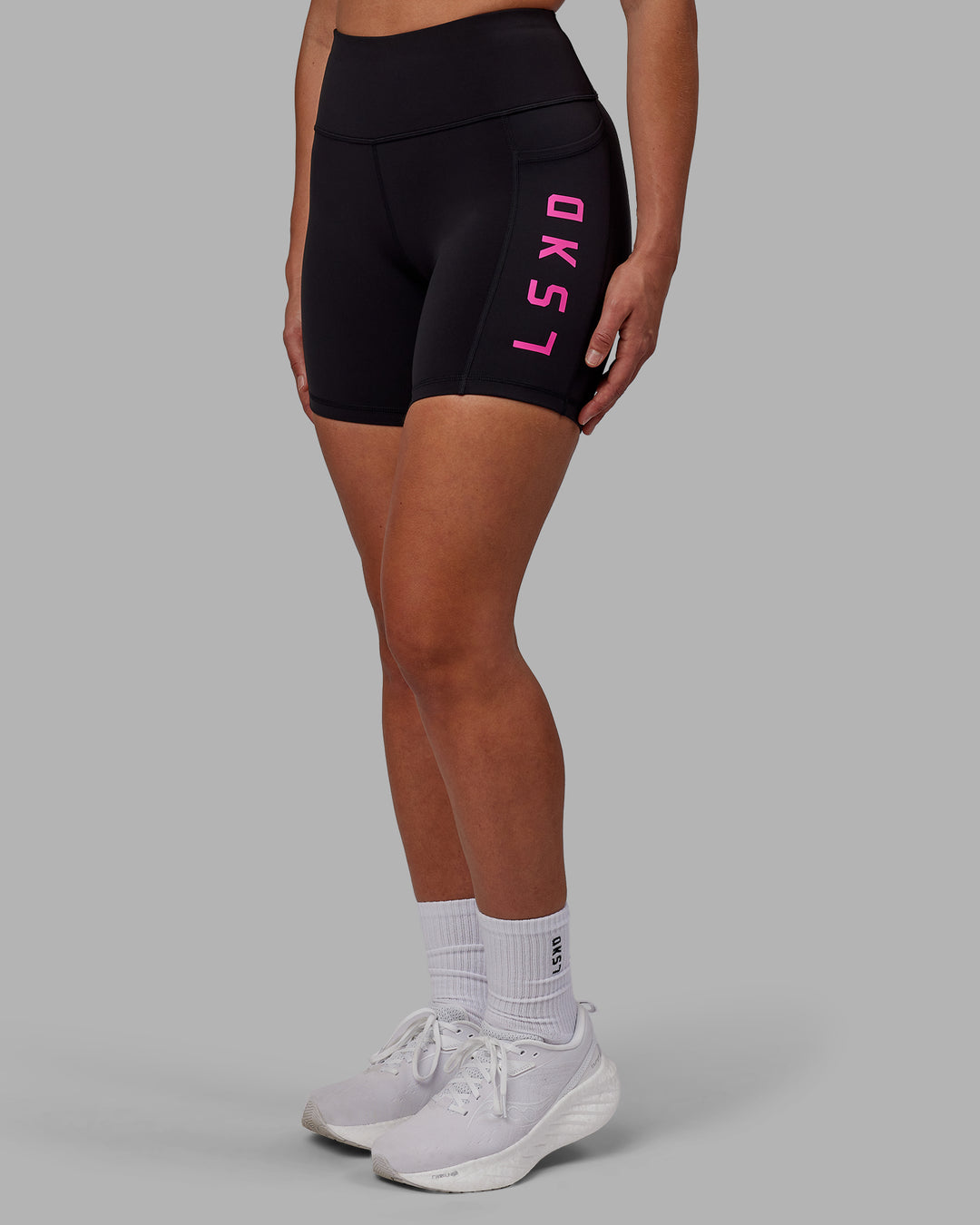 Woman wearing Rep Ultra High-Rise 6&quot; Short Pockets - Black-Fuchsia Pink | Model:Sophie | Size:S