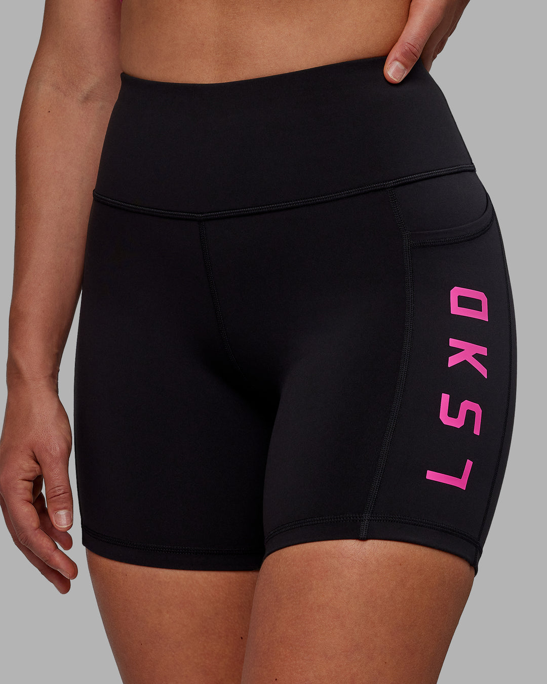 Woman wearing Rep Ultra High-Rise 6&quot; Short Pockets - Black-Fuchsia Pink | Model:Sophie | Size:S