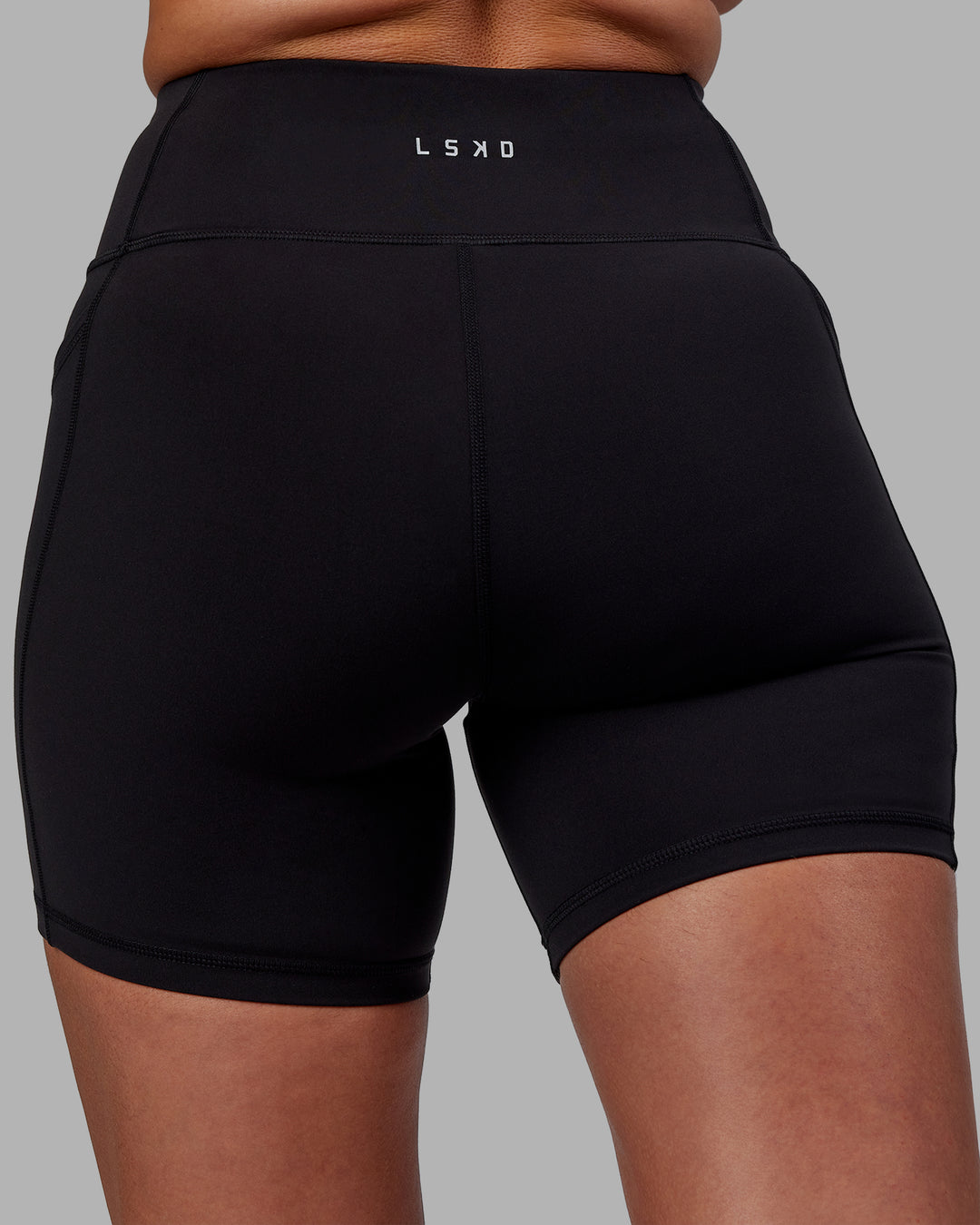 Woman wearing Rep Ultra High-Rise 6&quot; Short Pockets - Black-Fuchsia Pink | Model:Sophie | Size:S