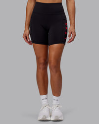 Woman wearing Rep Ultra High-Rise 6" Short Pockets - Black-Scarlet | Model:Demi | Size:S