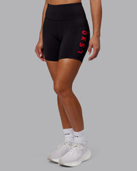 Woman wearing Rep Ultra High-Rise 6" Short Pockets - Black-Scarlet | Model:Demi | Size:S