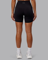 Woman wearing Rep Ultra High-Rise 6" Short Pockets - Black-Scarlet | Model:Demi | Size:S