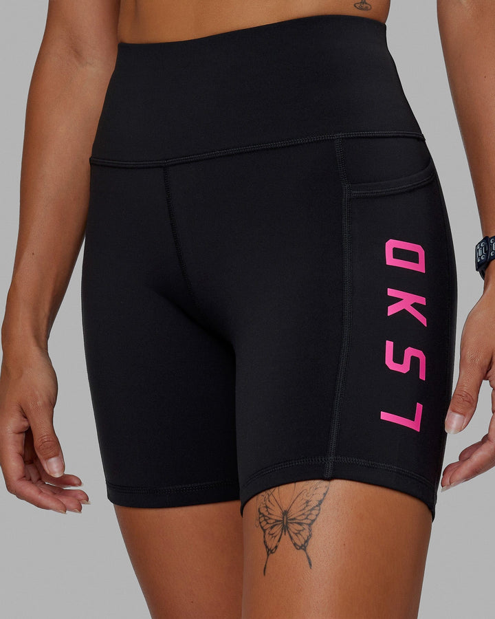 Woman wearing Rep Mid Short Tight - Black-Ultra Pink